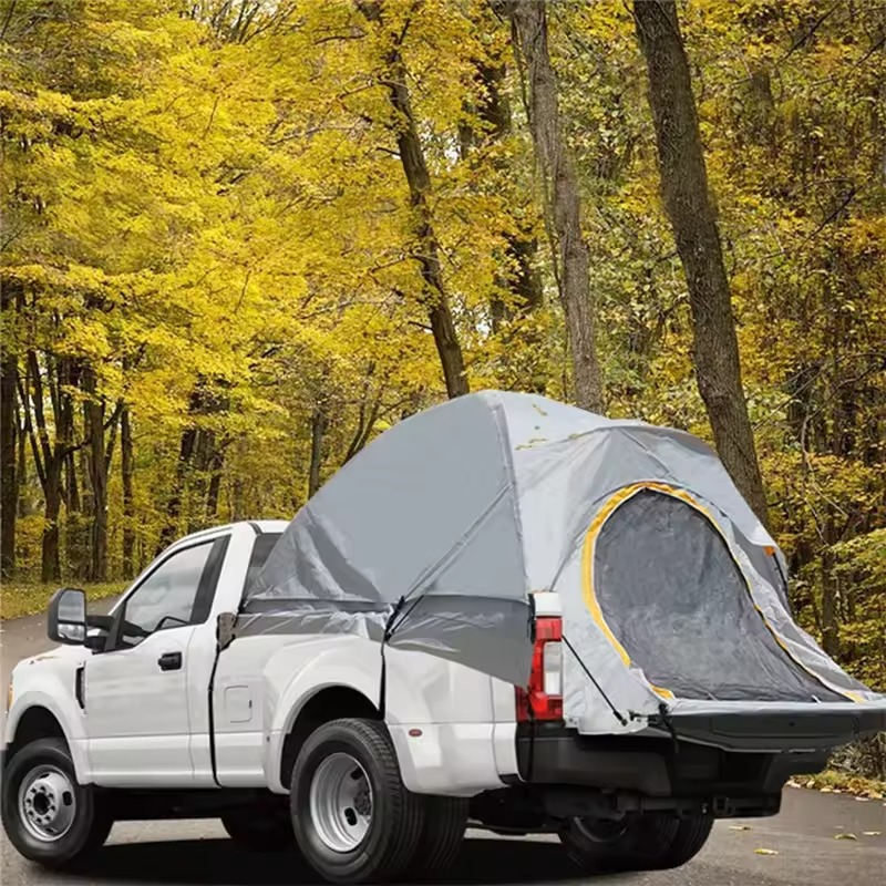 a white car with tent camper